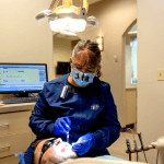 Dr. Tripp with a patient